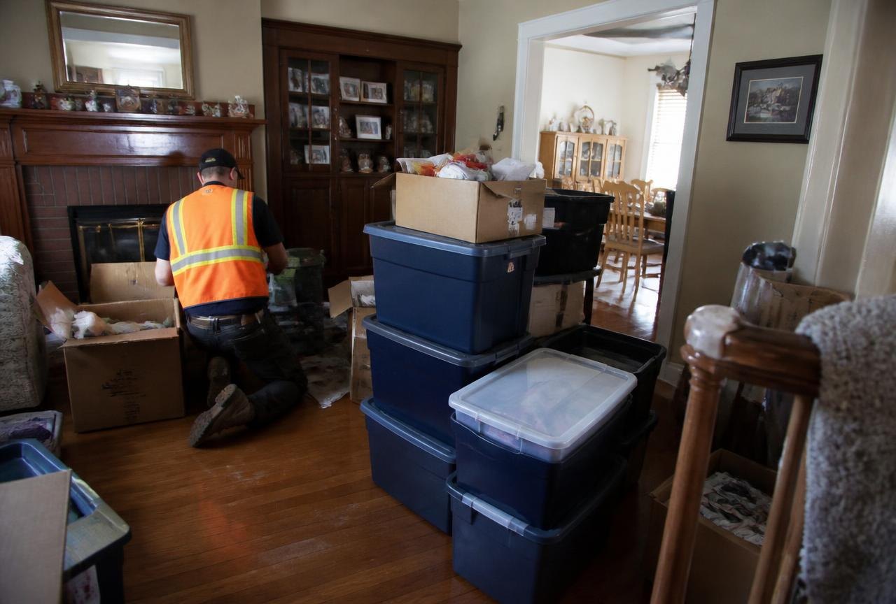 Estate Cleanouts | Genie Haul Junk Removal Genie Haul crew sorting a family home room by room during a documented estate cleanout.